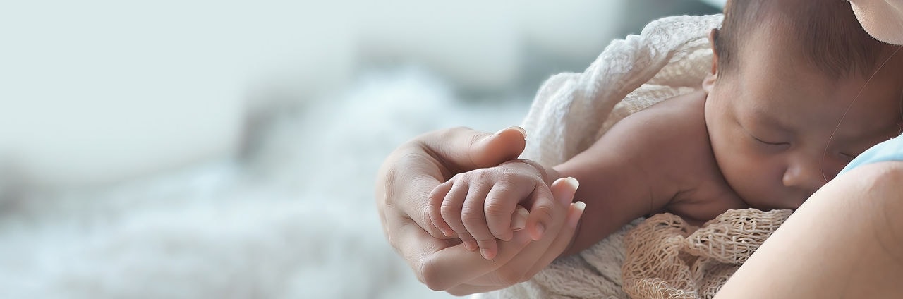 Mother cares for baby, comforting, and support, Asian Newborn 1-month-old at home